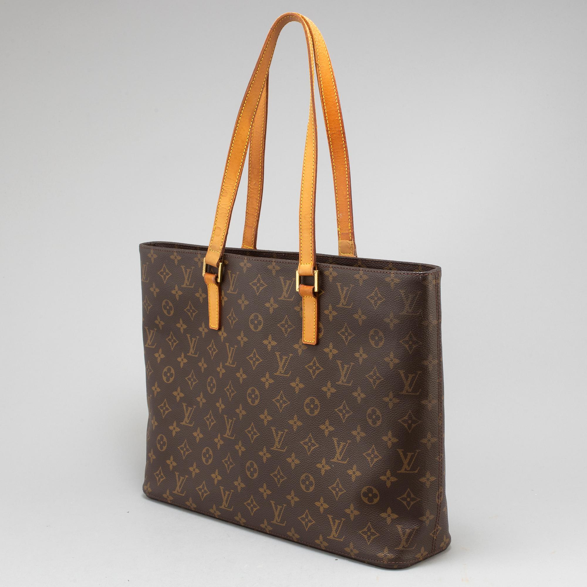 LOUIS VUITTON, a monogram canvas 'Luco' bag.