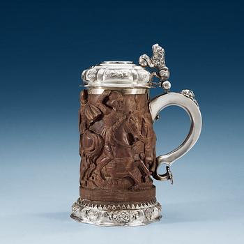 693. A Danish 18th century silver and wood tankard, un marked.