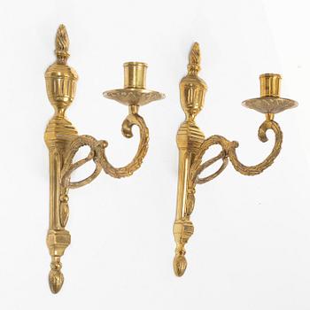 A pair of 'Törne' brass one-light wall ligths from IKEA's 18th Century collection.