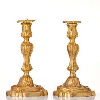 A pair of French 18th century gilt-bronz candlesticks, marked. Louis XV.