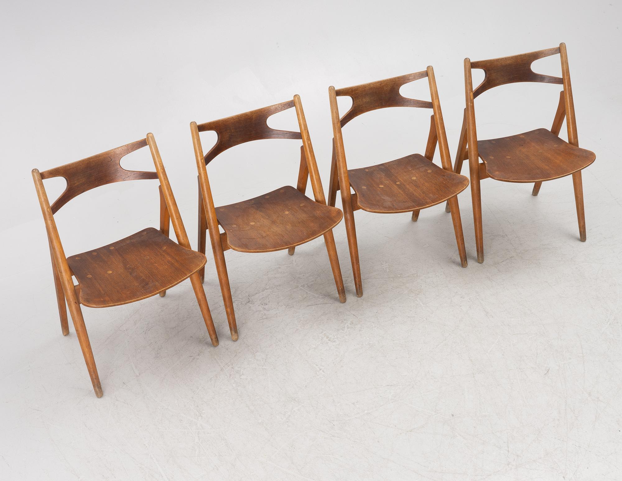 Hans J Wegner, four model CH 29 "The Savbuk Chair", Carl Hansen, 1960s.