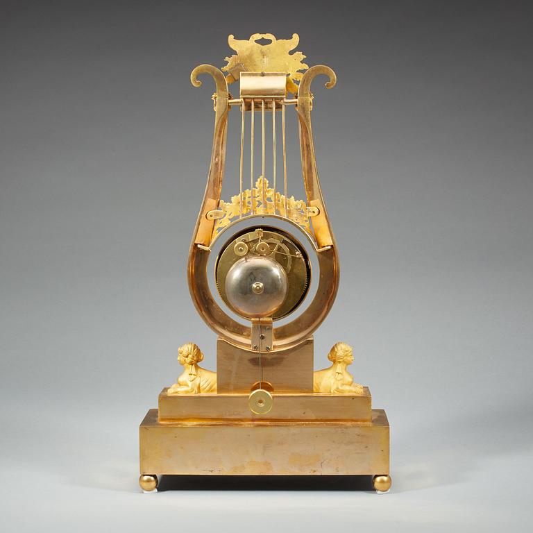 A late Gustavian early 19th century gilt bronze mantel clock.
