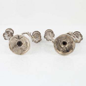 A rococo style pair of silverplated candelabras, end of the 19th Century..