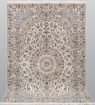 A Nain part silk carpet, 254 x 156 cm.