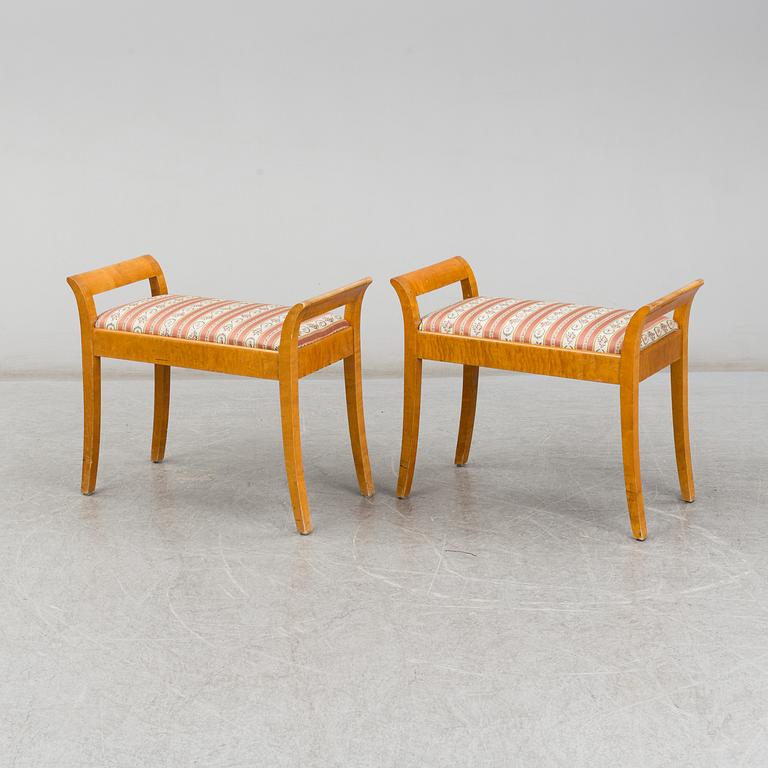 a pair of stools from the first half of the 20th century.