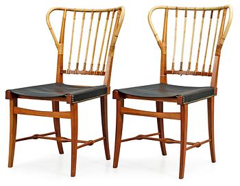 A pair of Josef Frank mahogany, bamboo and black leather chairs, Svenskt Tenn, model 1179.