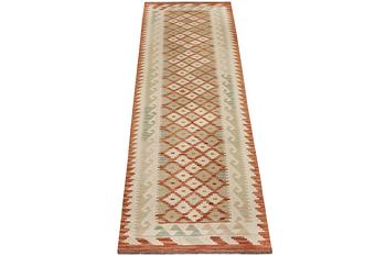 An Afghan kilim runner, c. 296 x 78 cm.