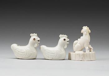 A pair of blanc de chine water droppers and a figure of a 'Buddhist Lion', Qing dynasty, Kangxi (1662-1722).