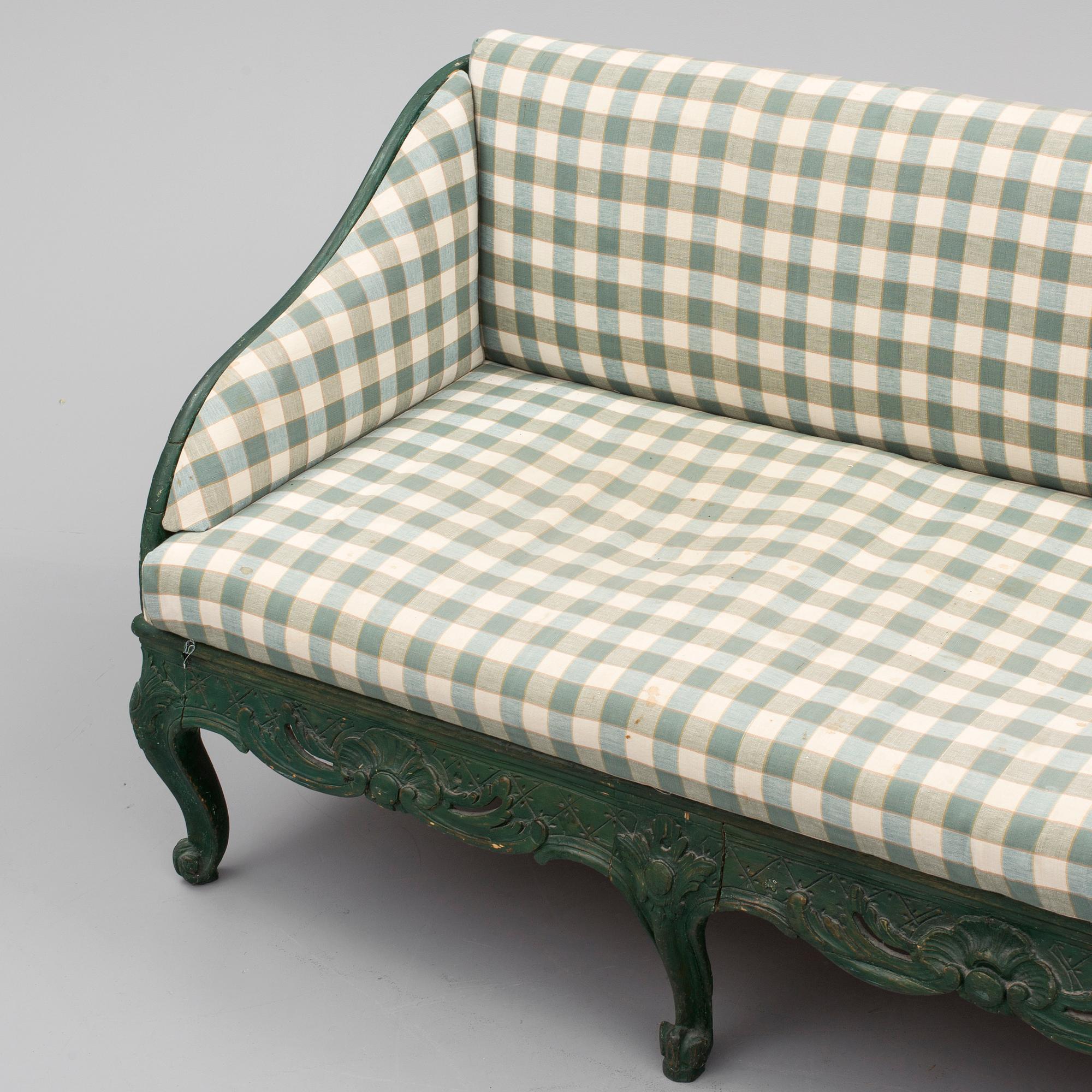A mid 18th century rococo sofa.
