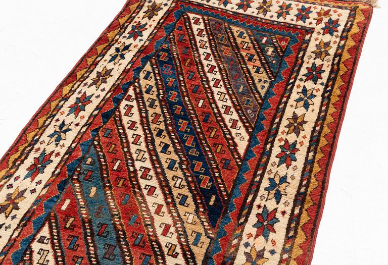 An antique Gendje rug, south Caucasus, c. 208 x 103 cm.