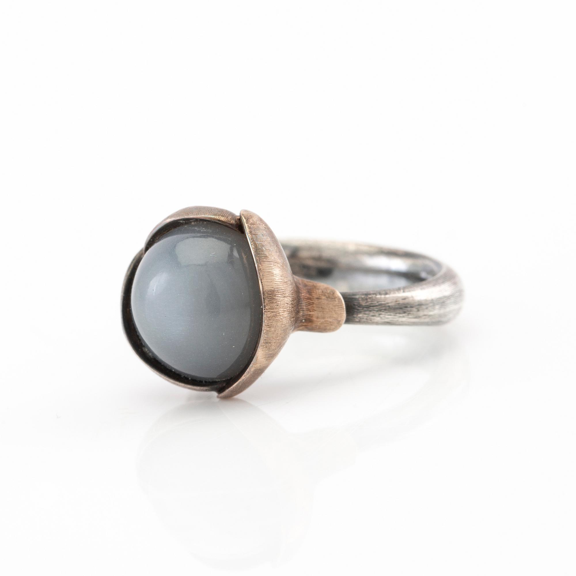 Ole Lynggaard, ring "Lotus" silver, white gold and cabochon-cut moonstone, design Charlotte Lynggaard.