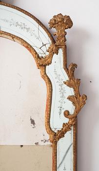 A Baroque gilt-lead and engraved glass mirror by Burchardt Precht (active in Stockholm 1674-1738).