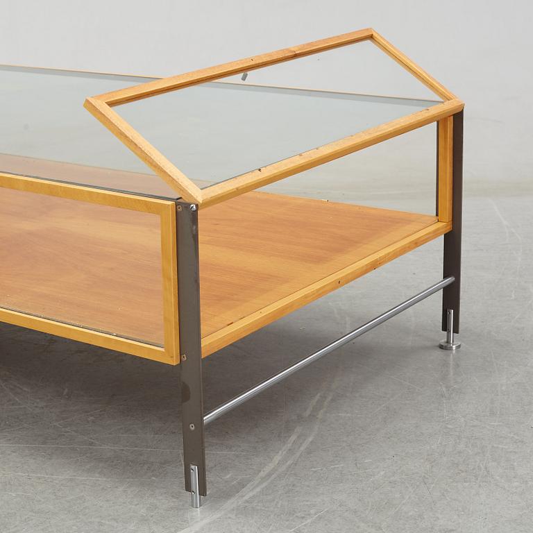 A glass top coffee table, late 20th Century.
