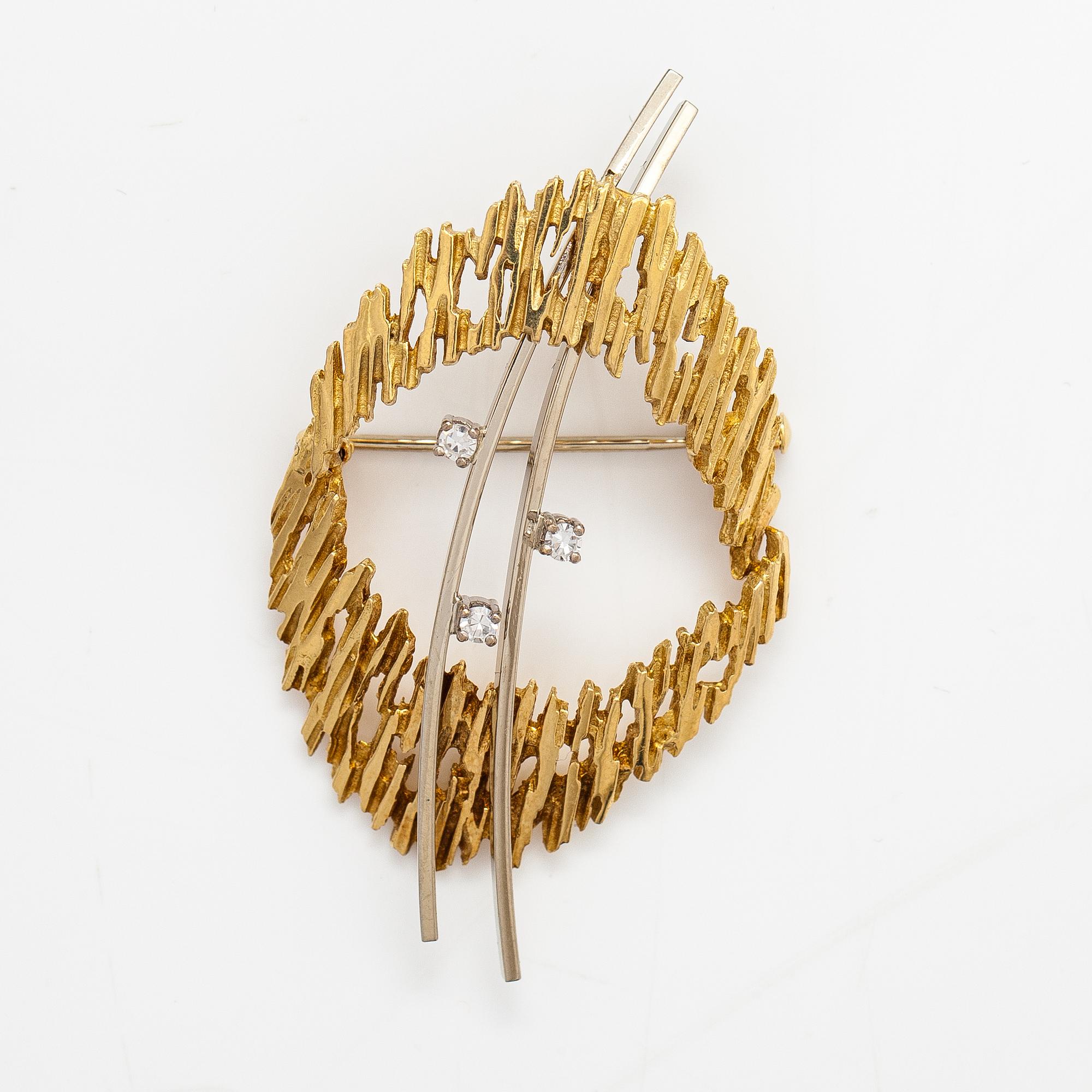 Brosch, 18K guld och diamanter ca 0.09 ct tot.