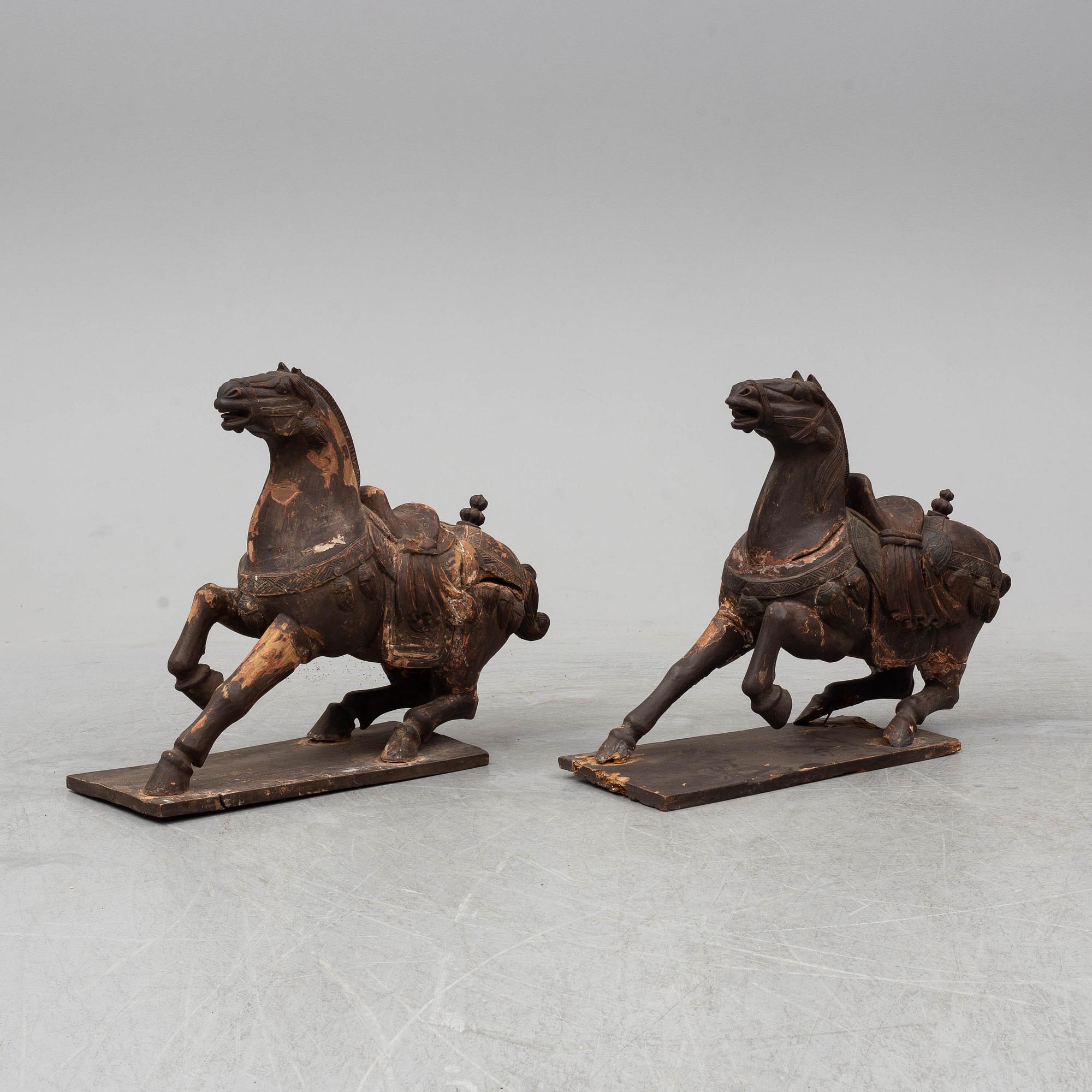 Two large wooden sculptures of horses, 20th century.