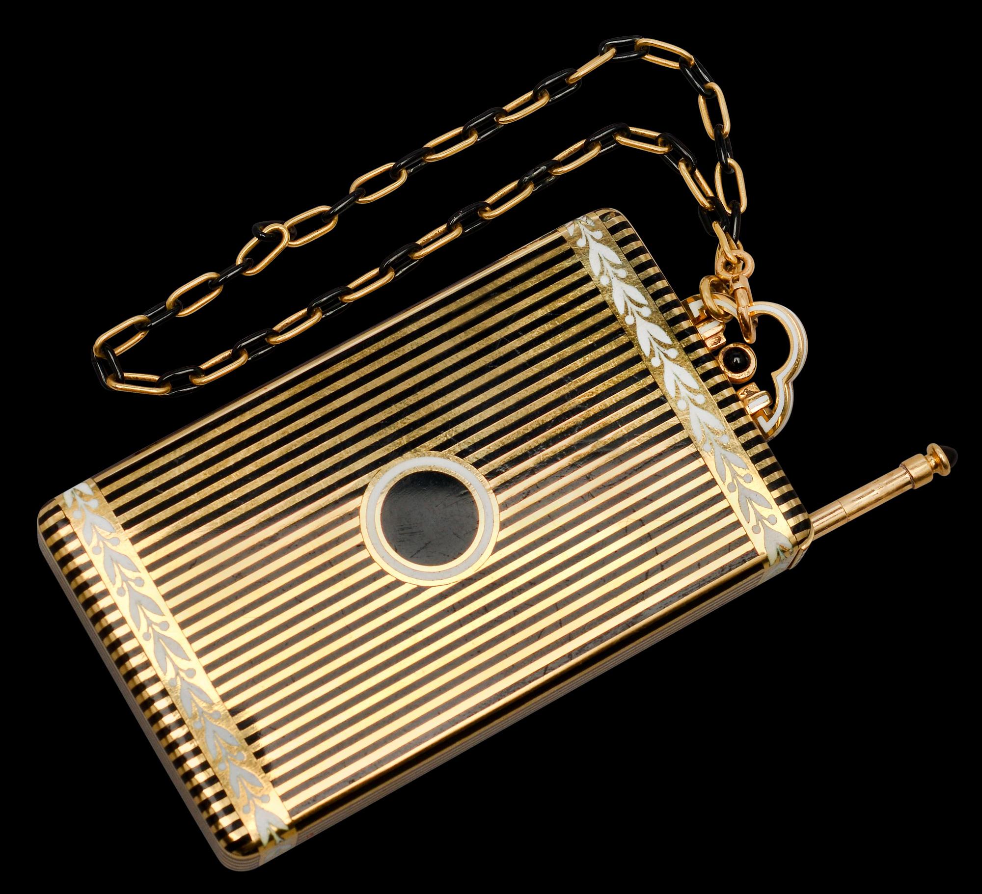 CARTIER MAKE-UP BOX, 18K gold, enamel, onyx. New York 1940 s. Weight 152 g.