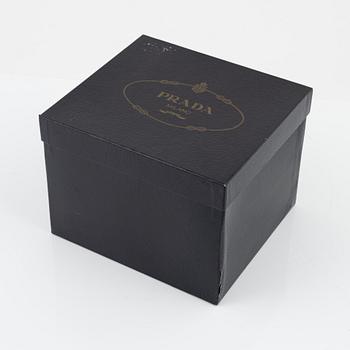 Prada, a satin bag.