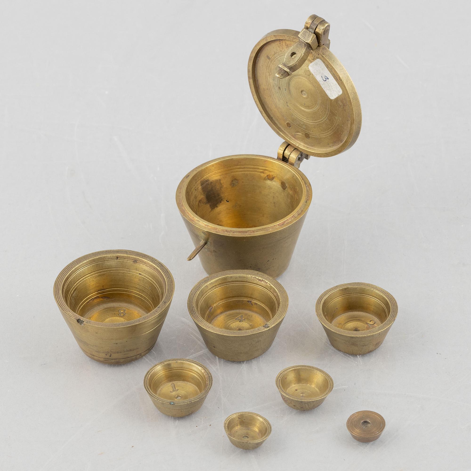 A set of three Nuremberg brass nested cup weights, one by Christoph or Johan Conrad Schön (masters 1746(1750).