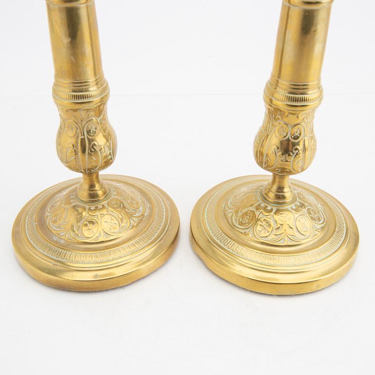 A pair of 19th century brass candle sticks.