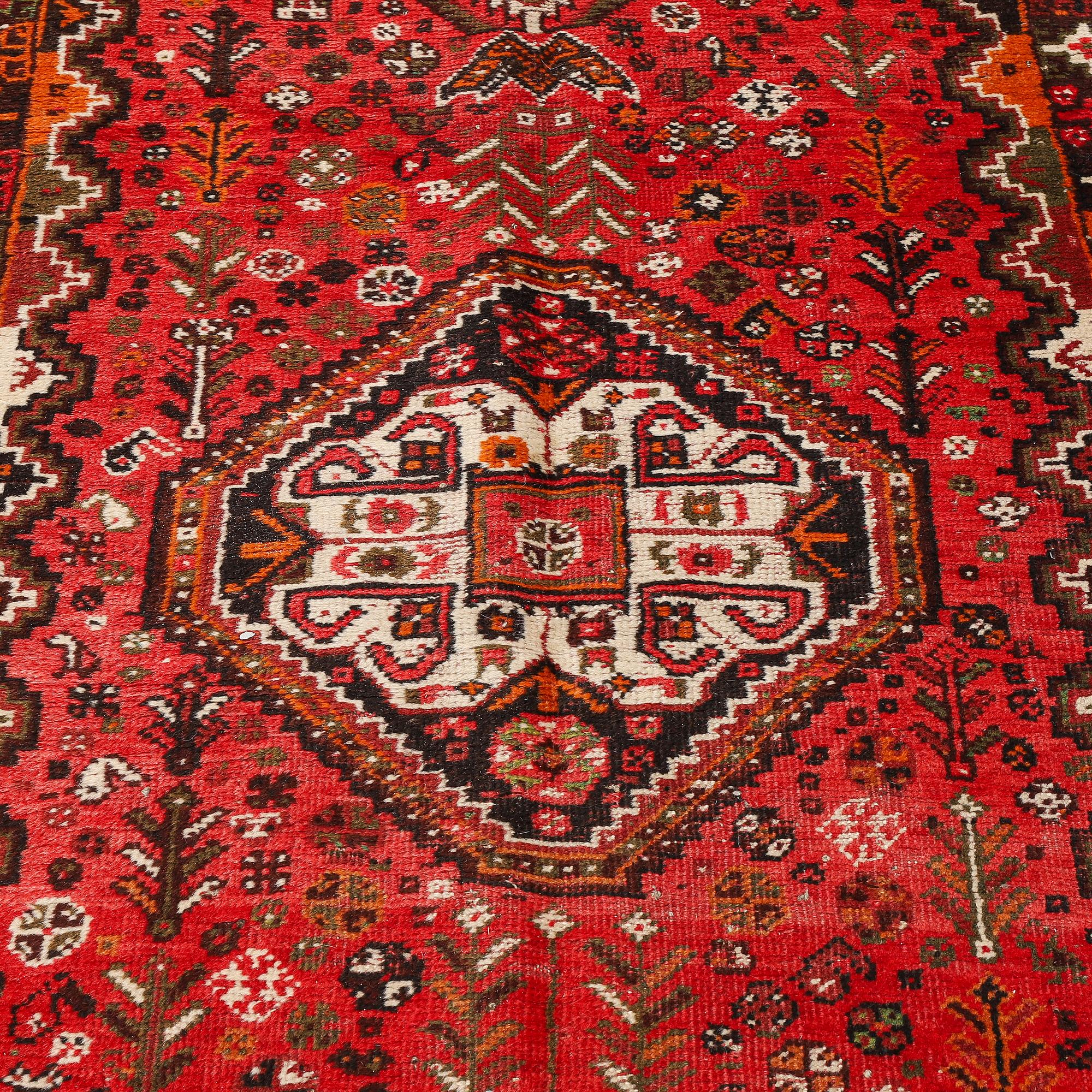 A rug, Shiraz, ca 292 x 115 cm.