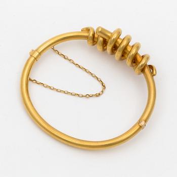 A 14K gold bracelet.