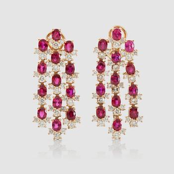 1402. A pair of ocal-cut ruby and brilliant-cut diamond earrings. Diamonds total carat weight circa 3.70 cts.