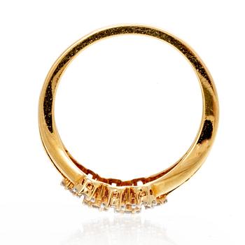 An 18K gold ring with octagonal cut diamonds.