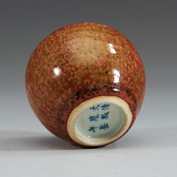 A peach bloom brush pot, late Qing dynasty (1644-1912), with Kangxi six character mark.