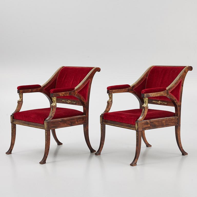 A pair of Empire style armchairs, first half of the 20th century.