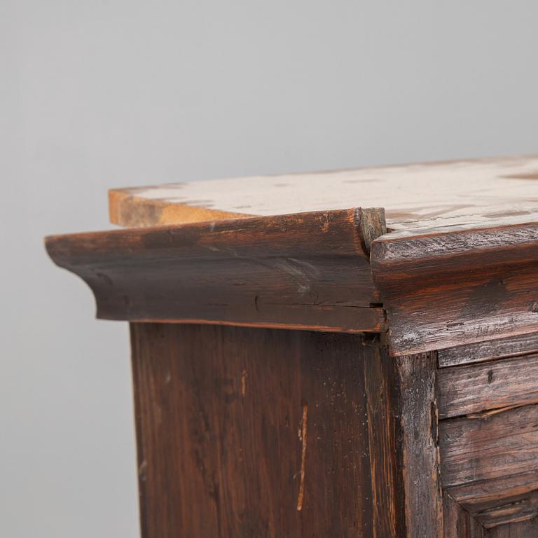 A Baroque cabinet on a later stand, early 18th Century.