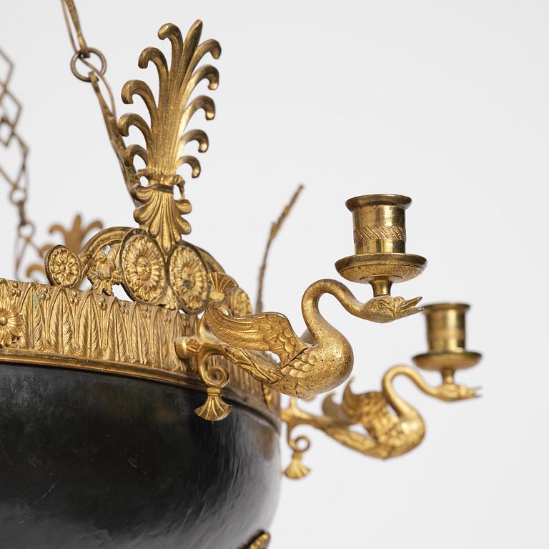 A presumably Russian Empire gilt and patinated bronze nine-branch chandelier, 19th century.
