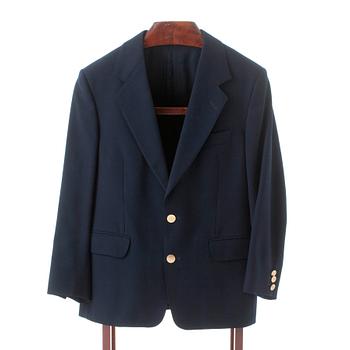 GÖTRICH, a dark blue club blazer and grey wool pants.