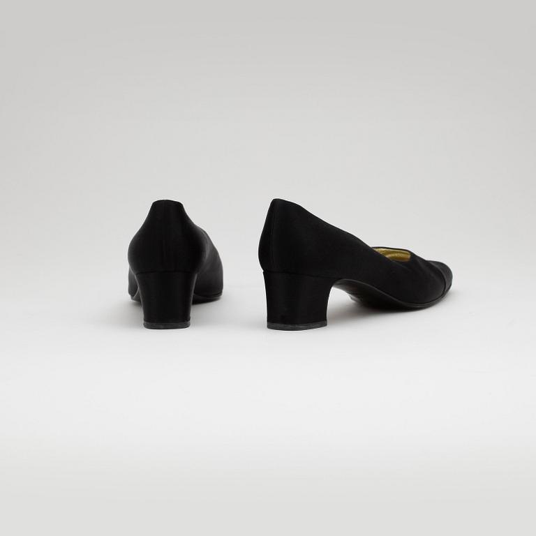 CHANEL, a pair of black satin pumps.