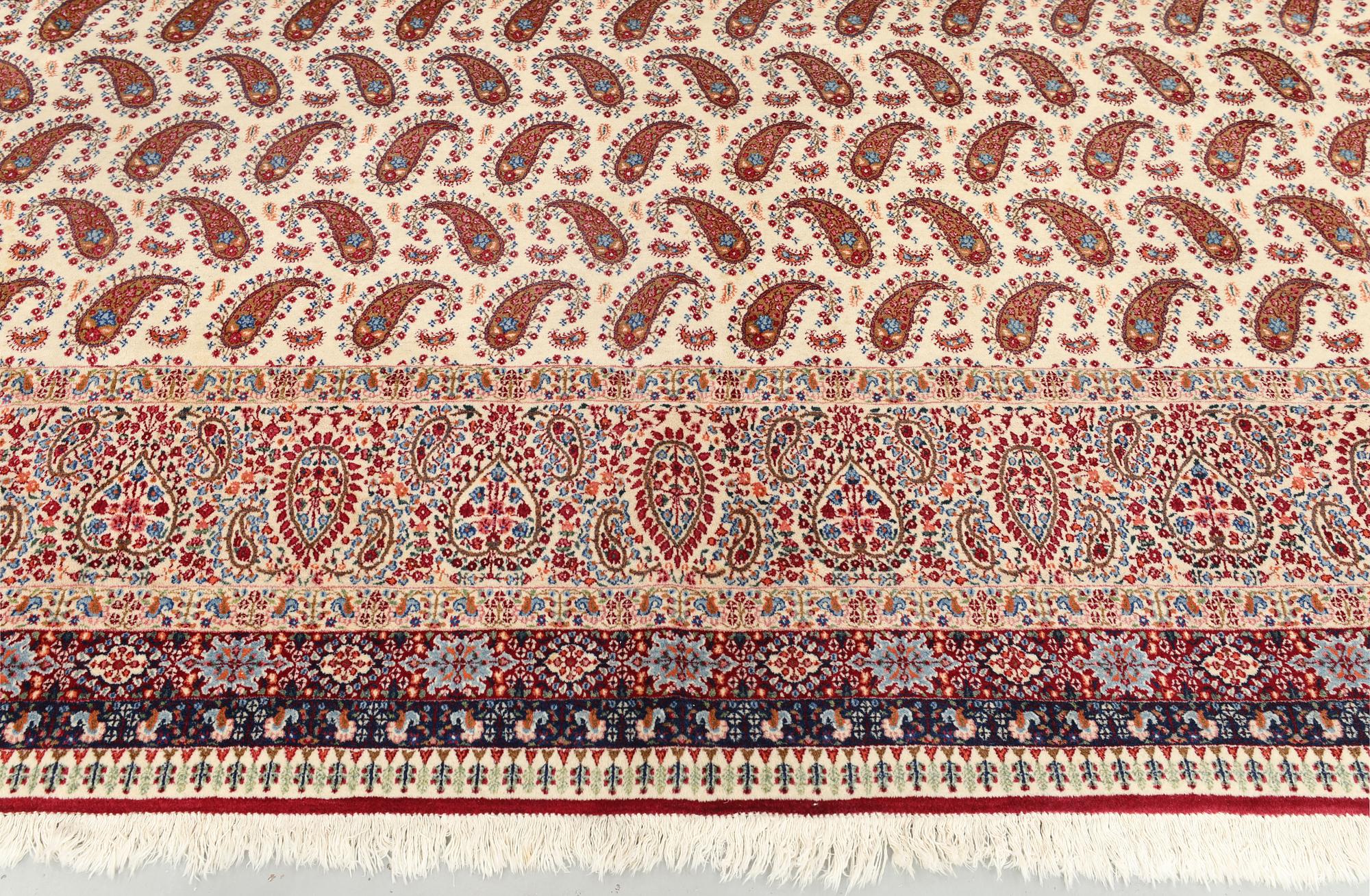 A Kirman carpet, signed, c. 390 x 295 cm.