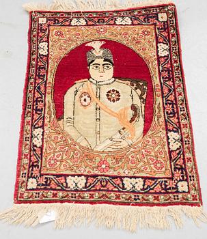 A rug, Antique Kerman laver, ca  68 x 45 cm.