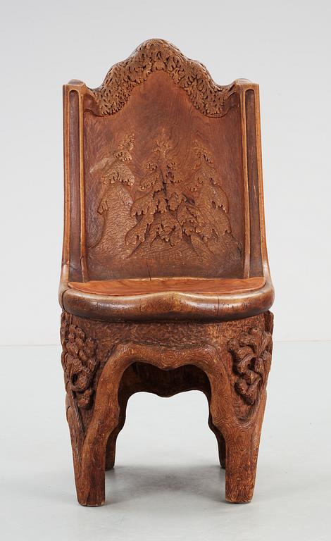 A Gustaf Fjaestad Art Nouveau sculptured pine chair, Sweden circa 1900.