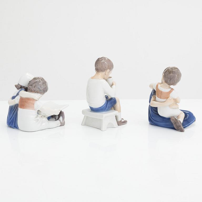Four Bing & Grondahl figurines and a Royal Copenhagen vase, mid 20th century.