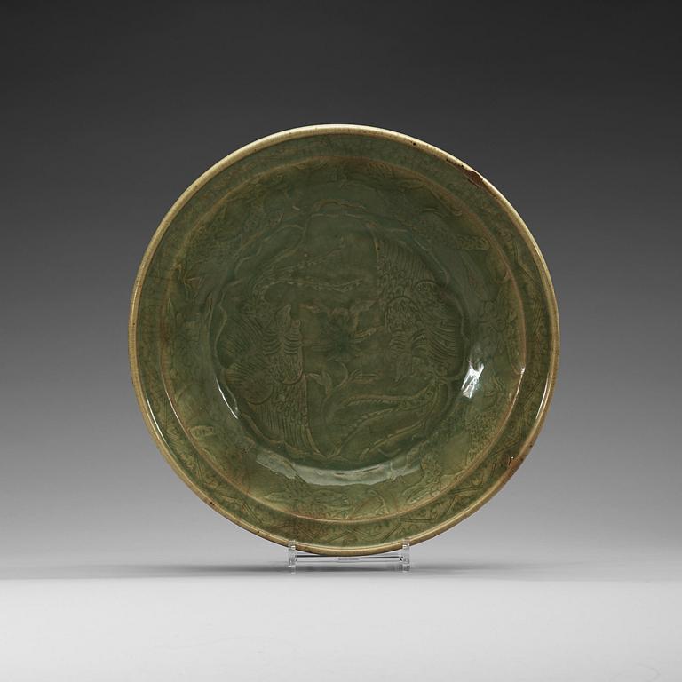 A large celadon charger, presumably southeast asia, 17th Century.