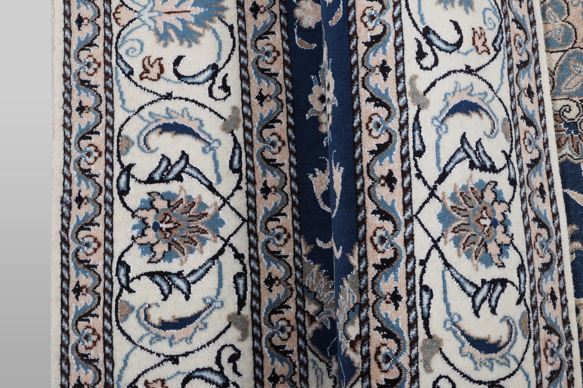 A carpet, Nain, part silk, ca 294 x 198 cm.