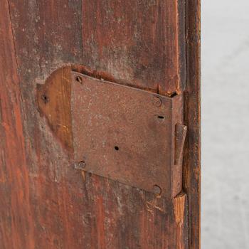 A painted corner cabinet, dated 1800.