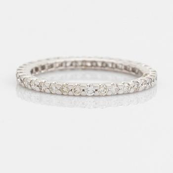 Brilliant-cut diamond eternity ring.
