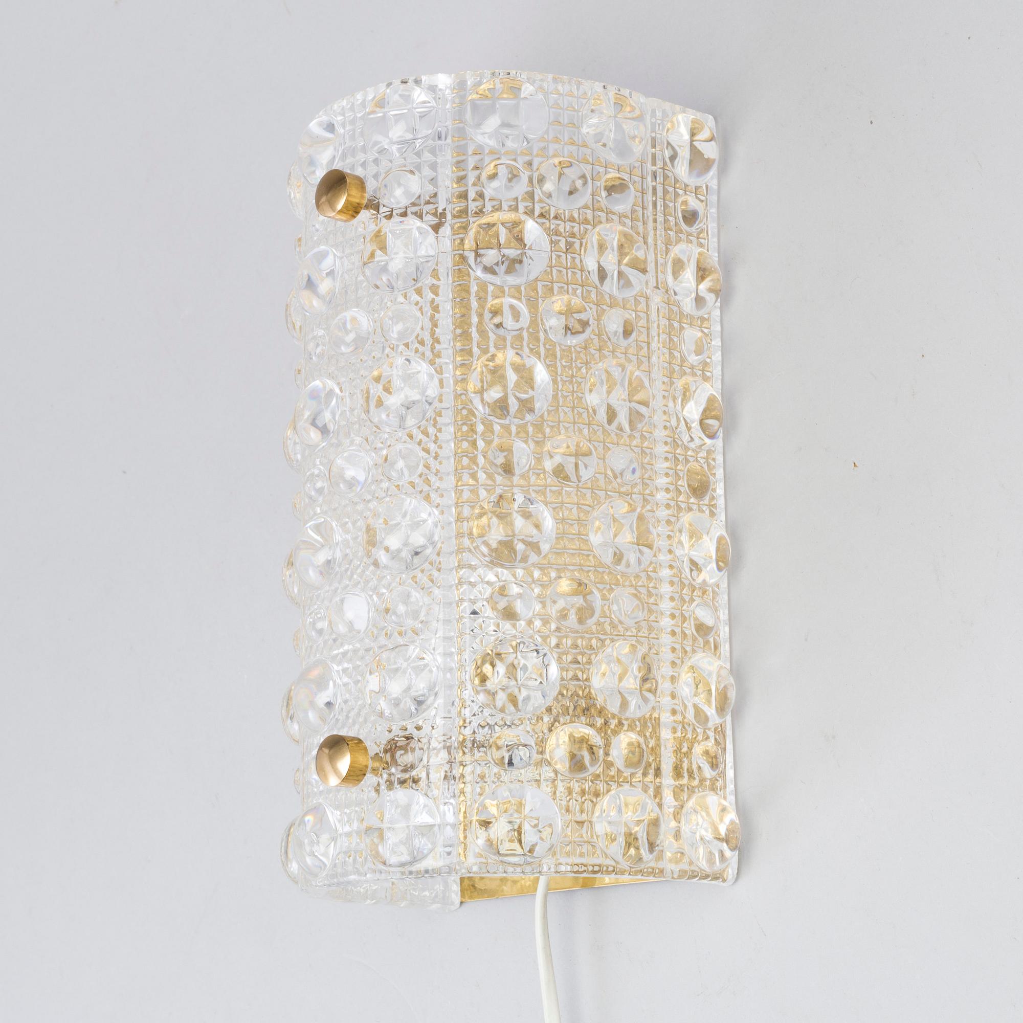 CARL FAGERLUND, a brass and glass Orrefors wall light, and a pait of wall lamps, unknown designer, 1960/70s.