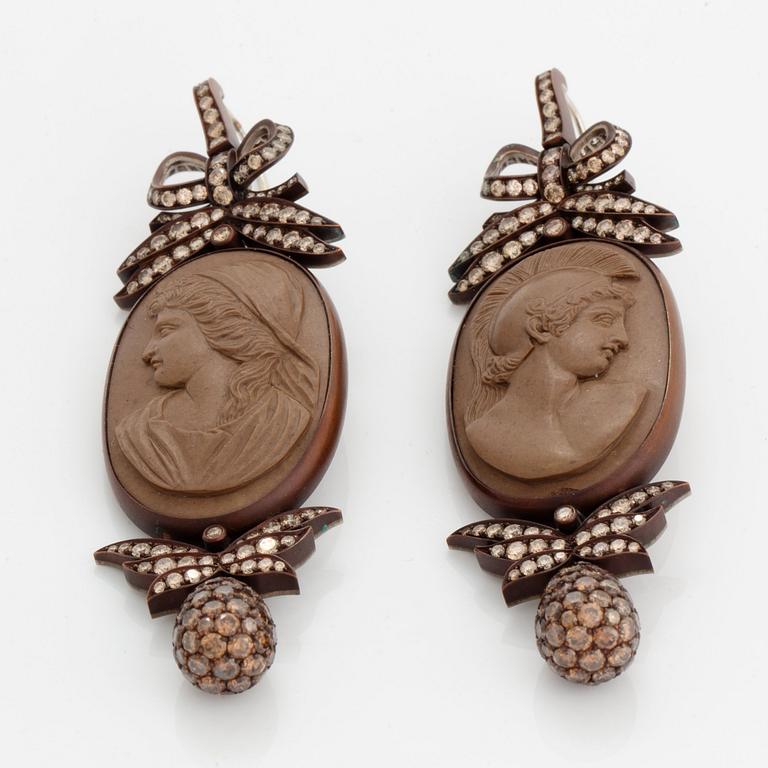 A pair of Hemmerle 19th century lava cameo earrings with classical portraits.