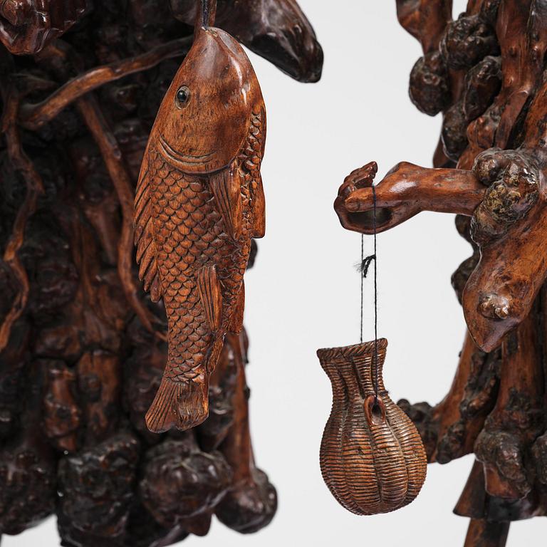 A large well sculptured root sculpture of 'Sholau and attendant', late Qing dynasty, 19th century.