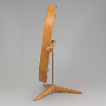 A Swedish 1960s mirror with stand, design Uno and Östen Krstiansson for Luxus Vittsjö.