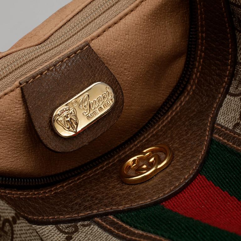 GUCCI, a monogram canvas handbag.