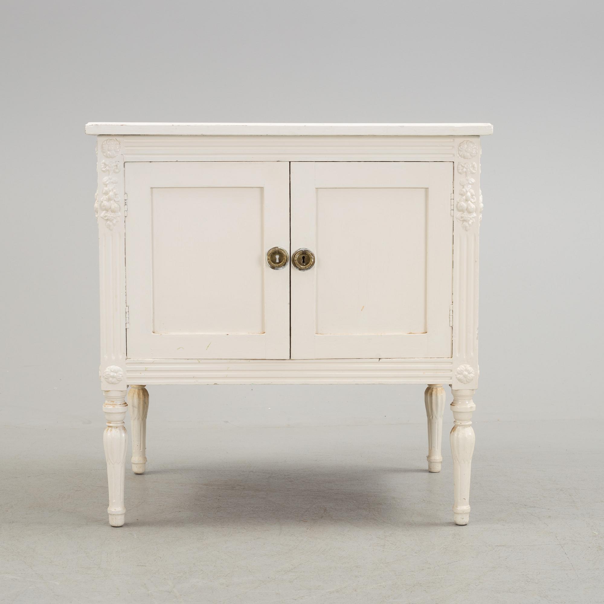 An early 20th century Gustavian style cupboard.