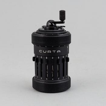 A 'Curta, Type I' calculator developed by Curt Herzstark, Contina AG Mauren, Lichtenstein, designed in 1947.