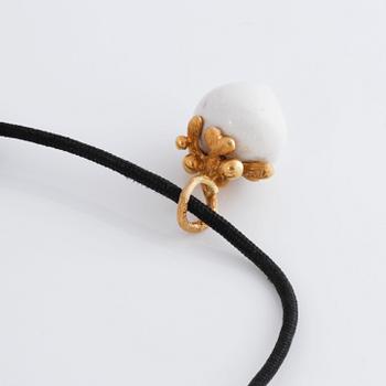 A bracelet, " My little world" by Charlotte Lynggaard.