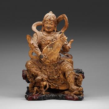 8. A wooden sculpture of a guardsman, Ming dynasty, (1368-1644).